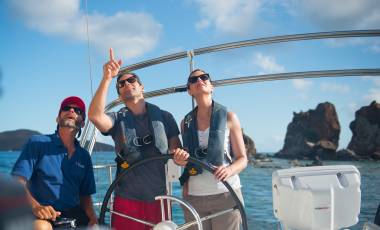 couple sailing Norman Island with crew